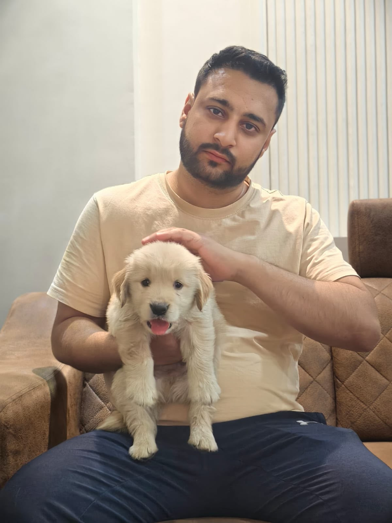 Customer with Golden Retriever puppy